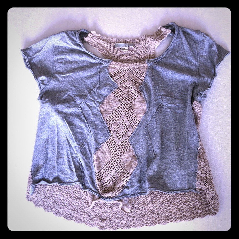 Crocheted t shirt with cut outs in the back.